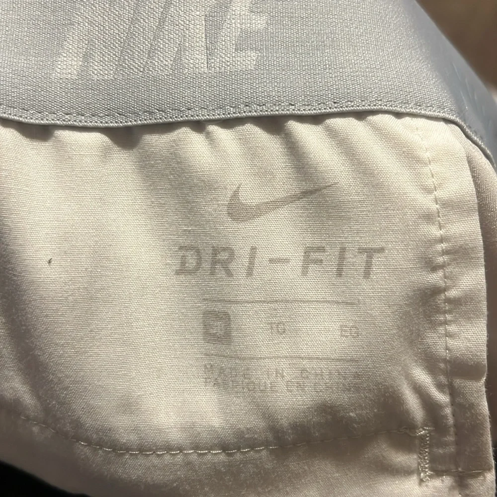 Nike mens cream flat front dri-fit shorts